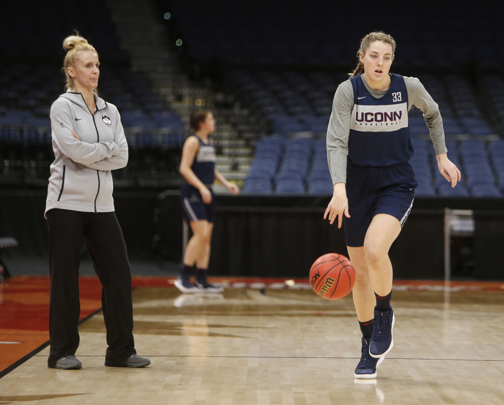 Connecticut's Katie Lou Samuelson, right, runs offensive drills in practice ahead of the NCAA Tournament's Final Four at the Amalie Arena in Tampa, Fla., on Thursday, April 4, 2019.